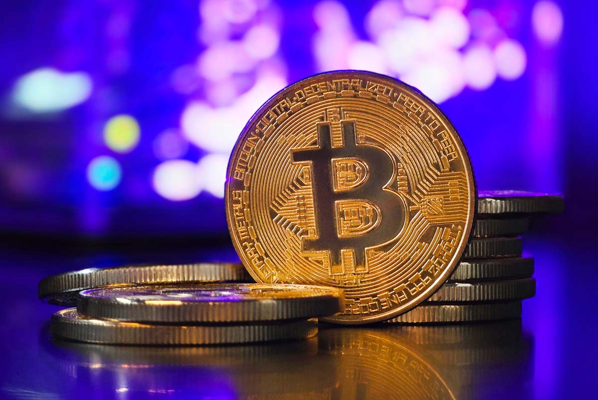 Alert: Crypto and dollar investment scams are rising in the Philippines Bitcoin against purple background