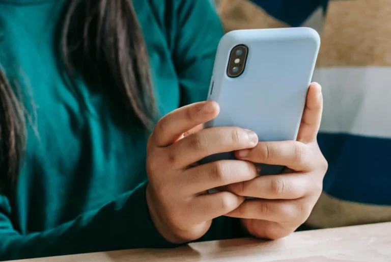 child holding a phone