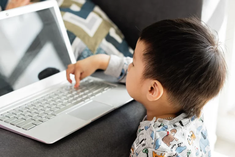 PLDT Home’s Online Alerto empowers families to stay safe online child using a laptop