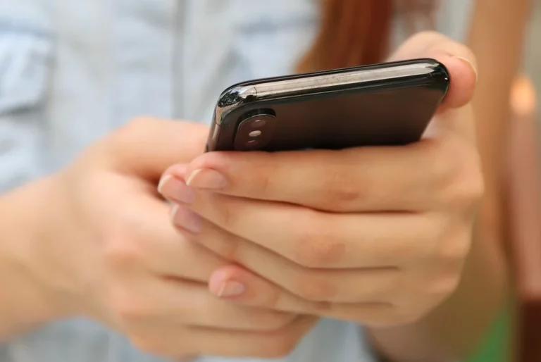 Smartphone shipments shrink 12% in 2026, says report smartphone in hand