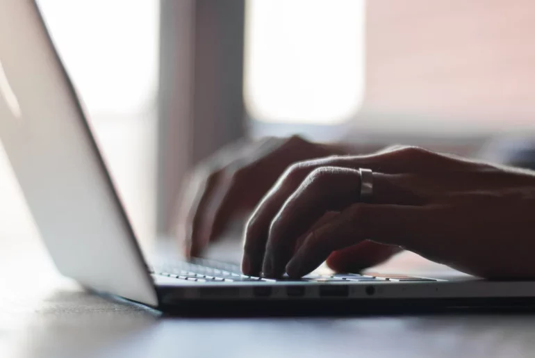 Report: 71% of organizations faced identity breaches in the past year typing on laptop