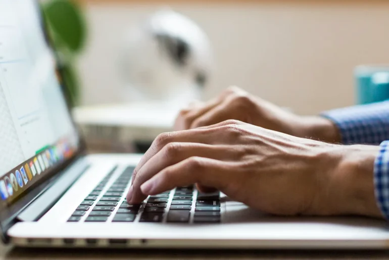typing on laptop