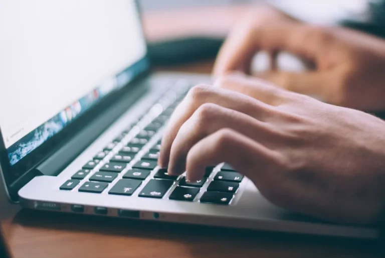 typing on laptop keyboard