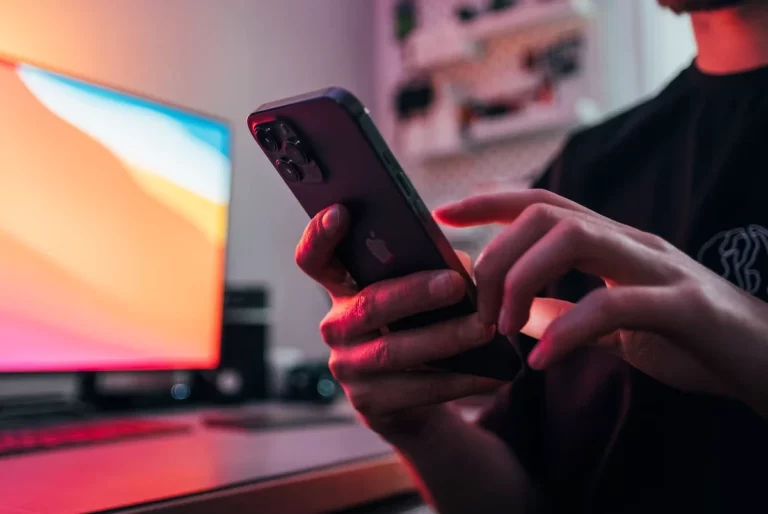 Meta will use more of your data to train AI young man holding a phone